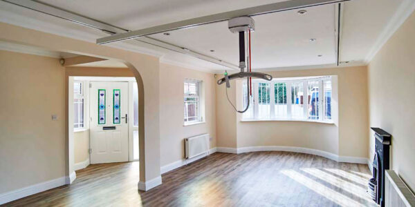 Photo of modern living room with ceiling track hoist system