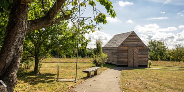 Photo of timber playhouse and swing