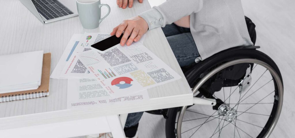Image of woman in wheelchair working from home