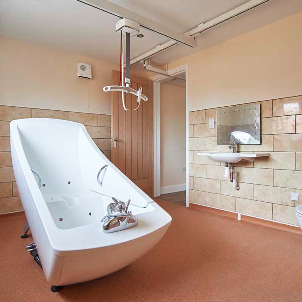 Accessible bathroom conversion Image of an accessible and disability adapted bathroom with ceiling hoists.